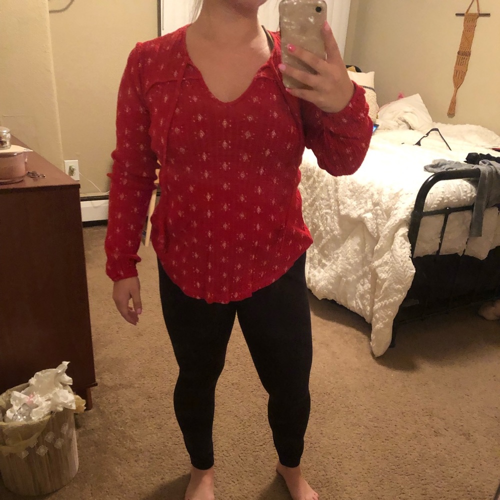 Red pattered long sleeved shirt